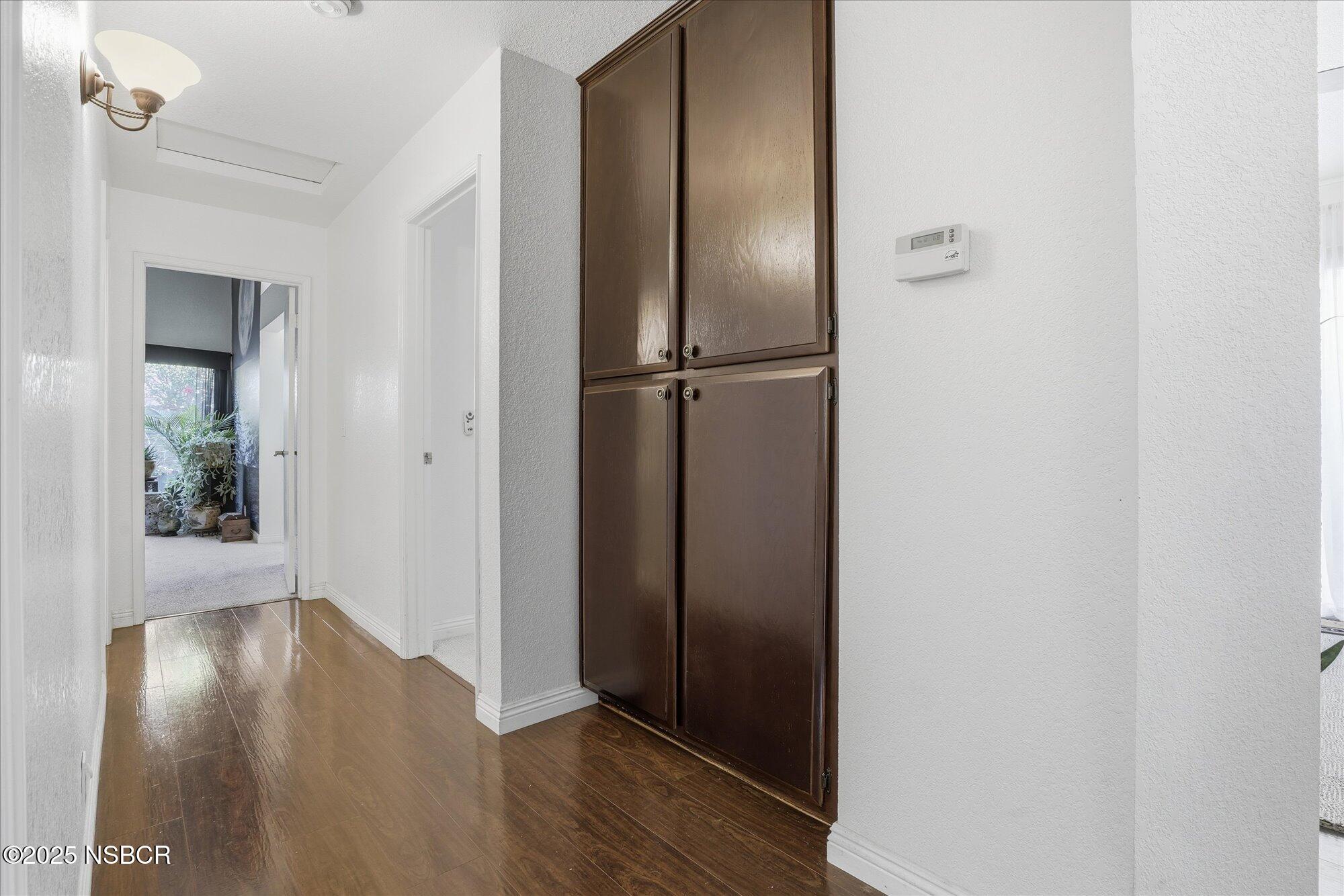 4300 Ridgecrest Street Santa Maria, CA 93455 - Photo 14 of 40 a view of a hallway with wooden floor