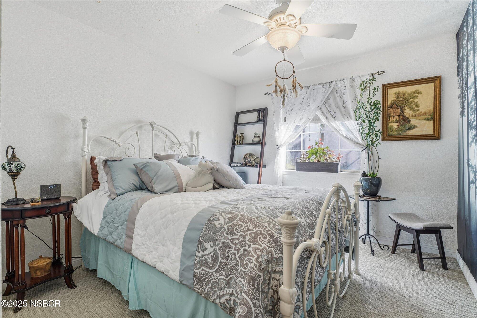 4300 Ridgecrest Street Santa Maria, CA 93455 - Photo 18 of 40 a bed room with a bed and a chandelier