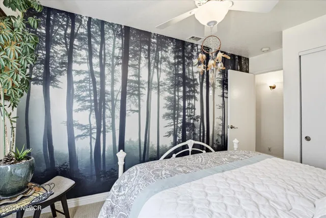 a bedroom with a bed and a table