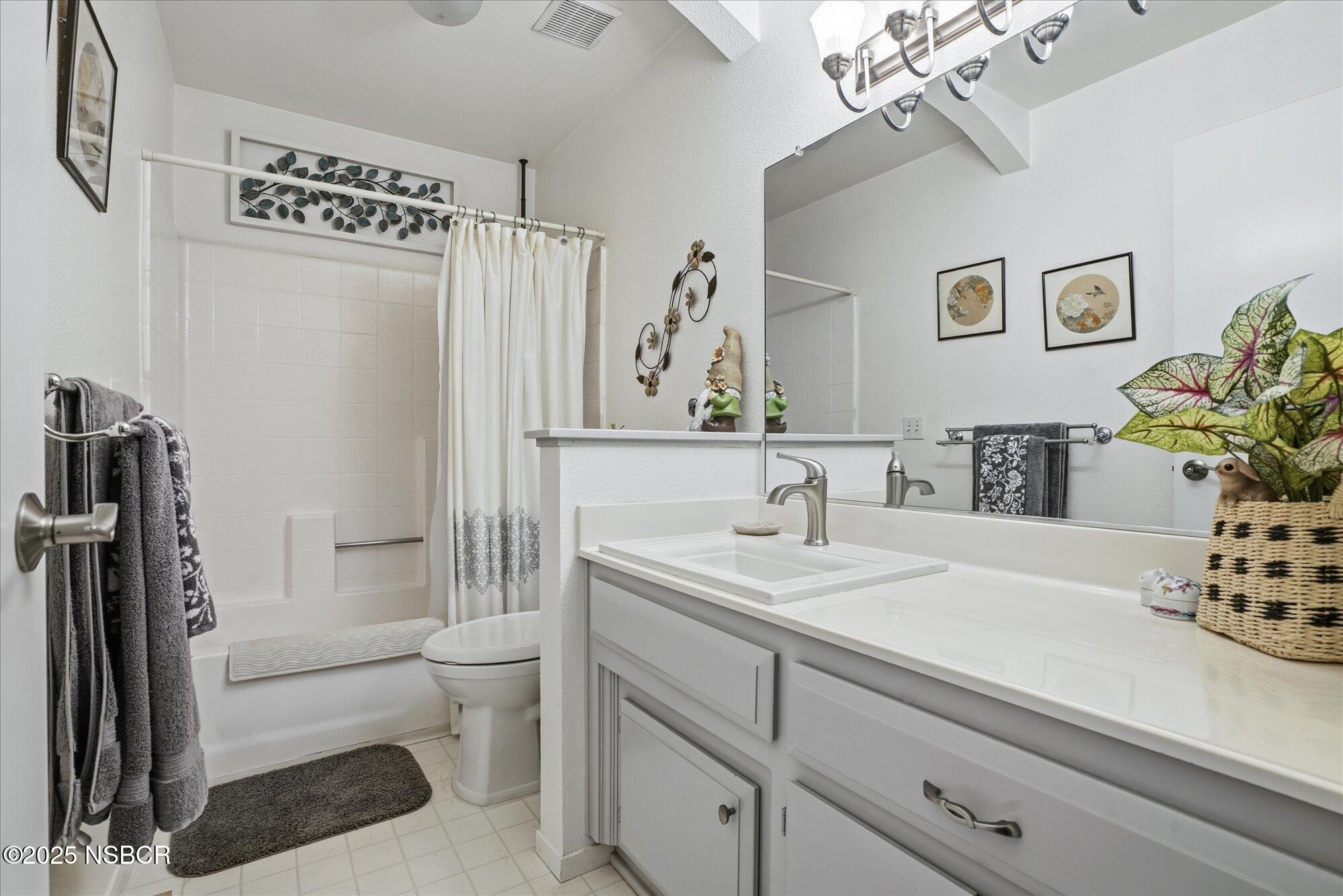 4300 Ridgecrest Street Santa Maria, CA 93455 - Photo 20 of 40 a bathroom with a sink a toilet and shower