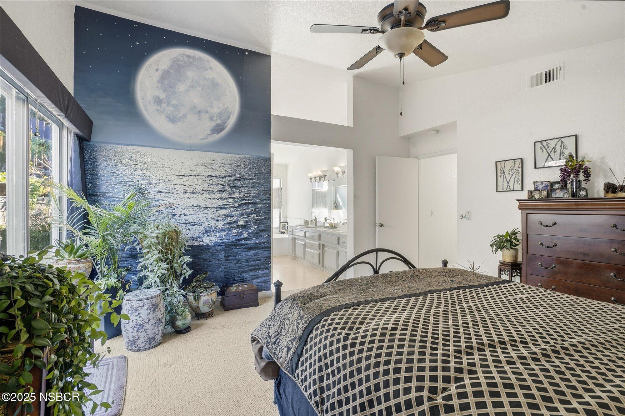 4300 Ridgecrest Street Santa Maria, CA 93455 - Photo 22 of 40 a bedroom with a bed and a chandelier