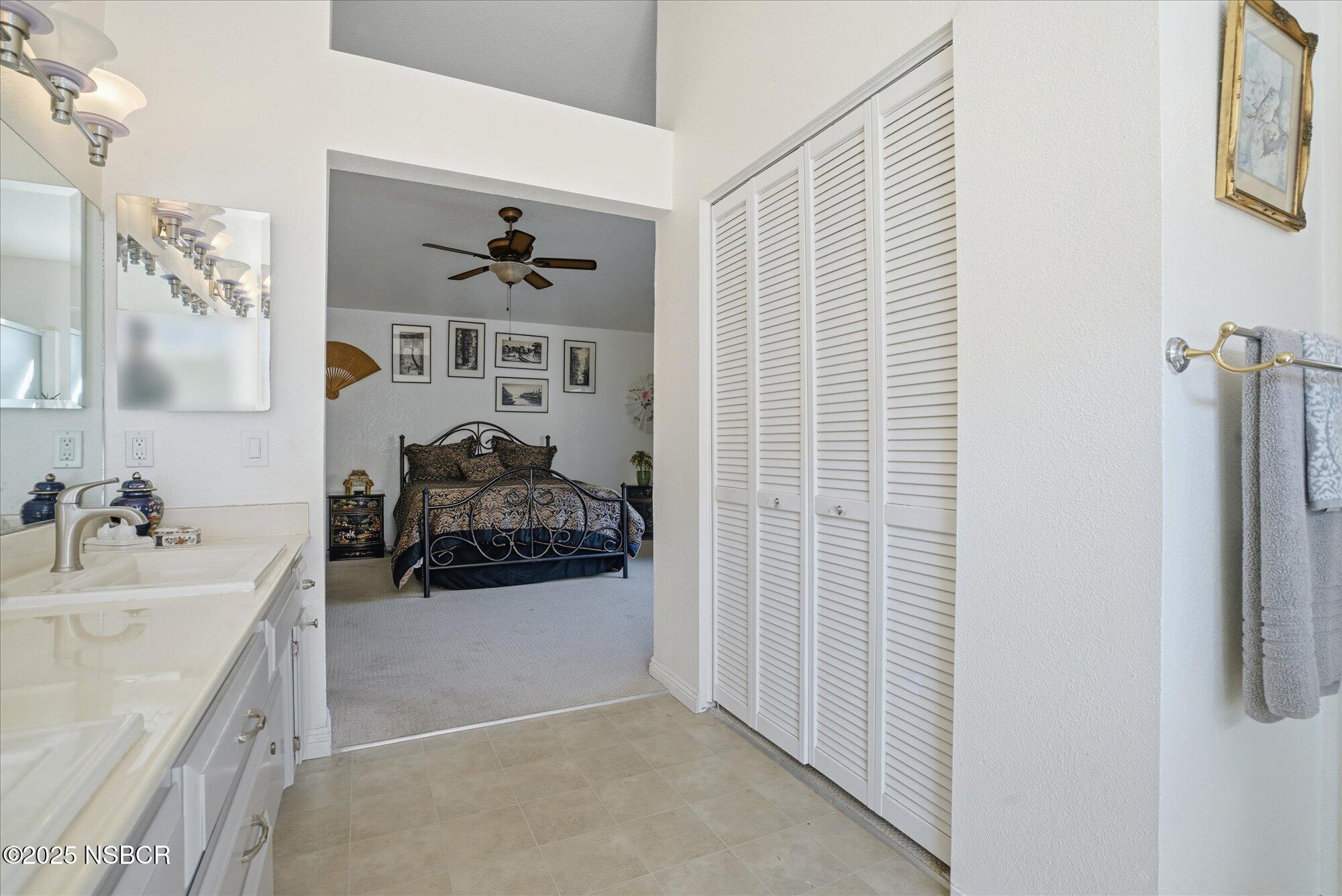 4300 Ridgecrest Street Santa Maria, CA 93455 - Photo 25 of 40 a en suite bathroom with a sink and a mirror