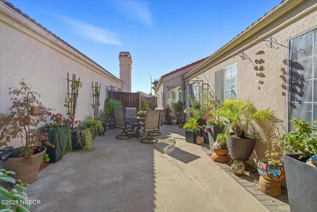 a view of a chairs and table in a patio