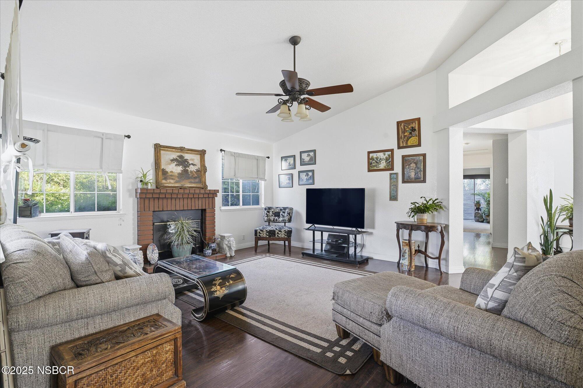 4300 Ridgecrest Street Santa Maria, CA 93455 - Photo 6 of 40 a living room with furniture a fireplace and a flat screen tv