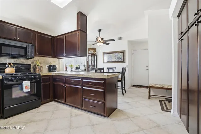 a kitchen with a sink cabinets and stainless steel appliances
