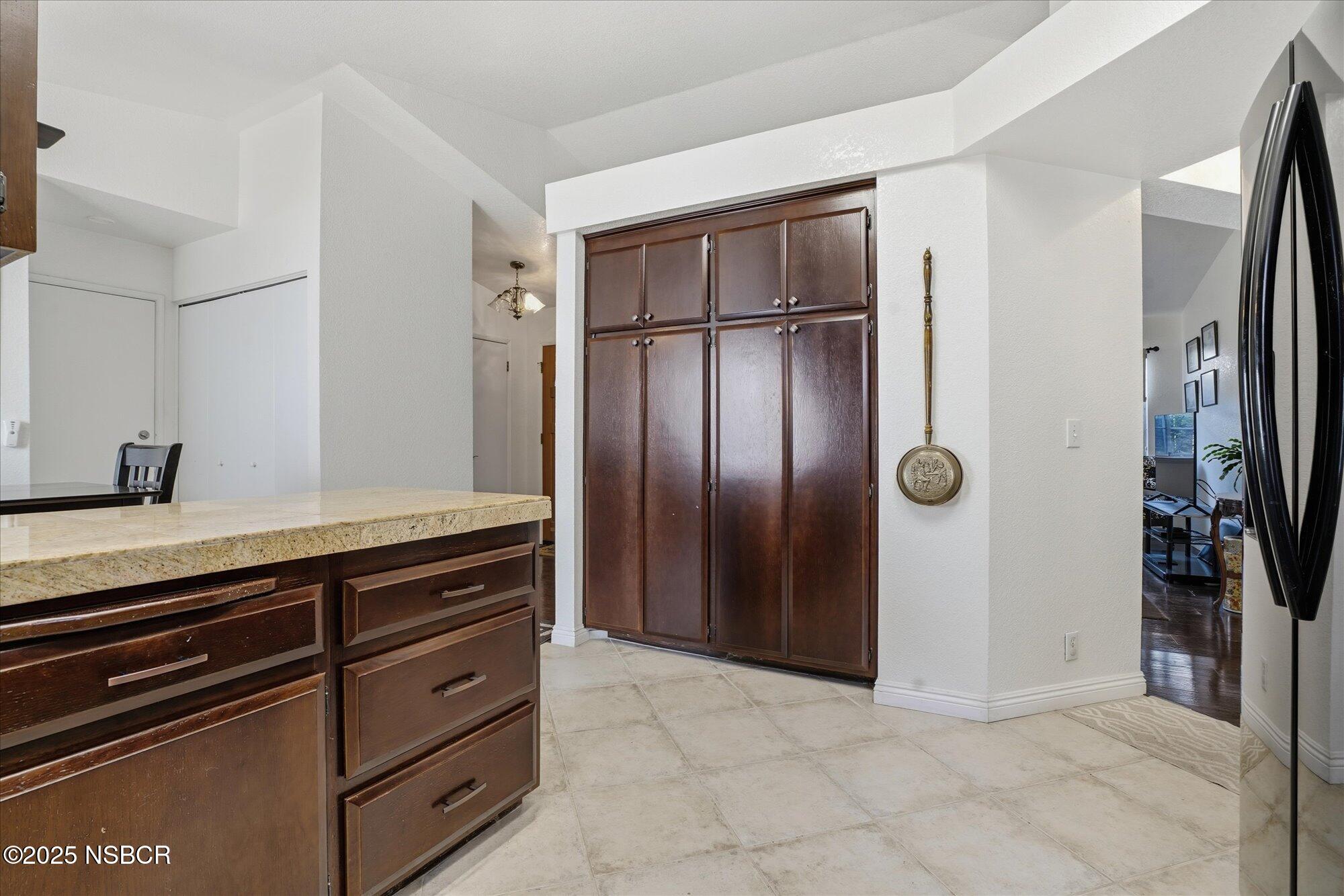 4300 Ridgecrest Street Santa Maria, CA 93455 - Photo 10 of 40 a kitchen with stainless steel appliances a refrigerator and cabinets