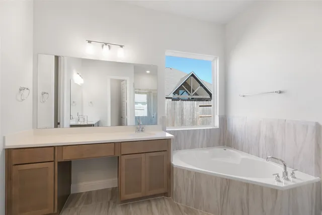 a bathroom with a shower and a sink