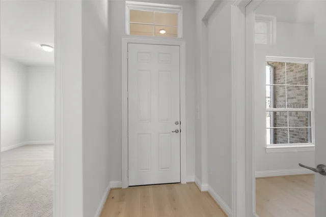 a view of hallway with windows