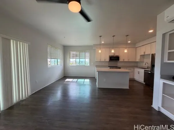 a view of kitchen and kitchen with sink