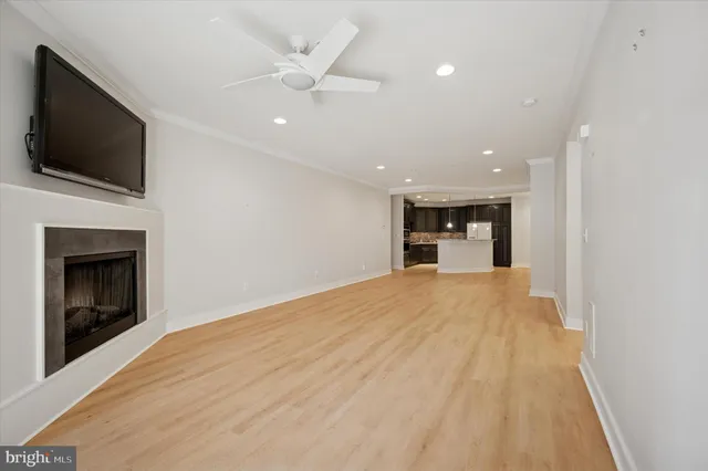 a view of an empty room with a fireplace