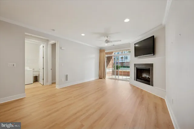 a view of a livingroom with an empty space and a fireplace