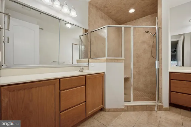a bathroom with a shower and a sink