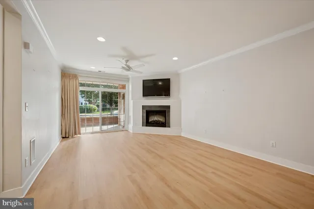 wooden floor in an empty room with a fireplace