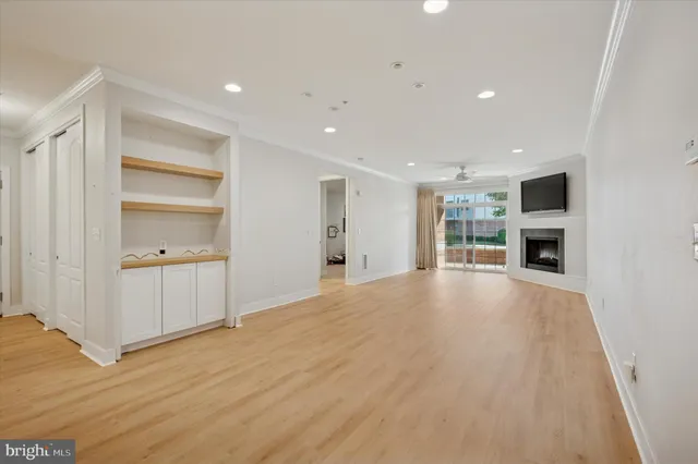 a view of a kitchen with a sink and a refrigerator