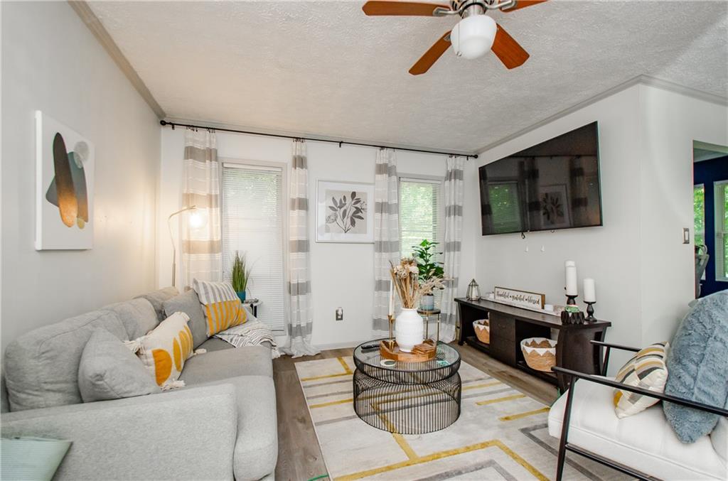 5157 Roswell Road, Unit 2 Atlanta, GA 30342 - Photo 3 of 24 a living room with furniture and a flat screen tv