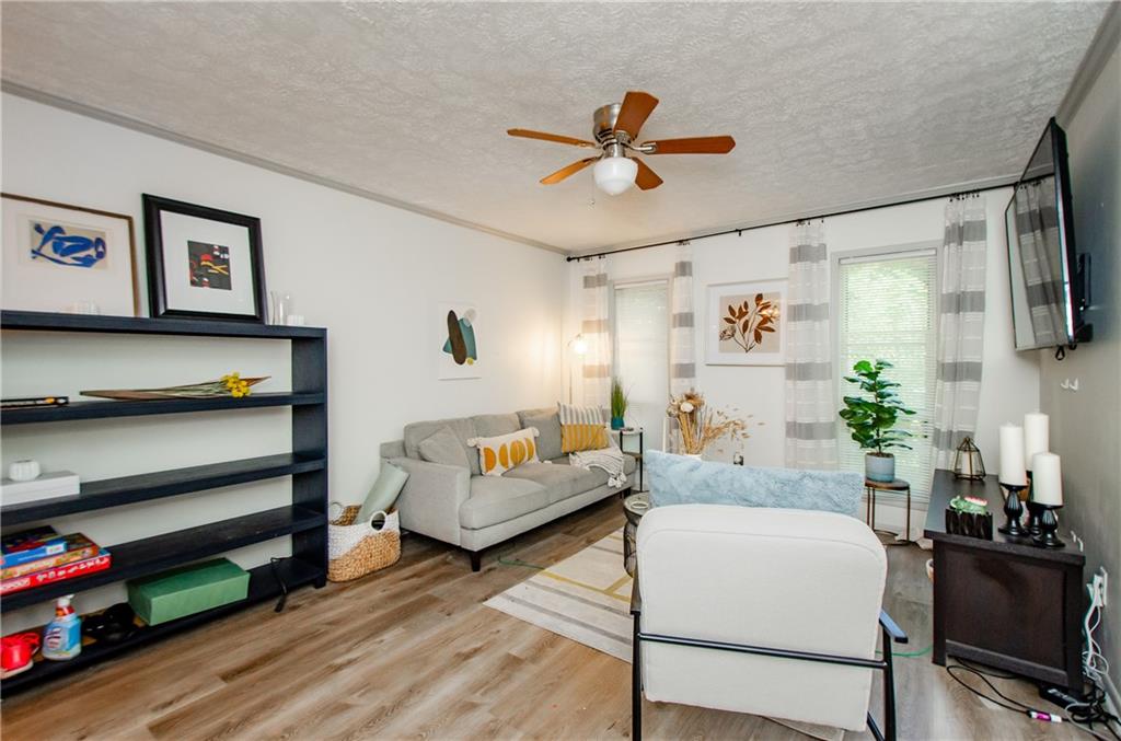 5157 Roswell Road, Unit 2 Atlanta, GA 30342 - Photo 5 of 24 a living room with furniture and a flat screen tv