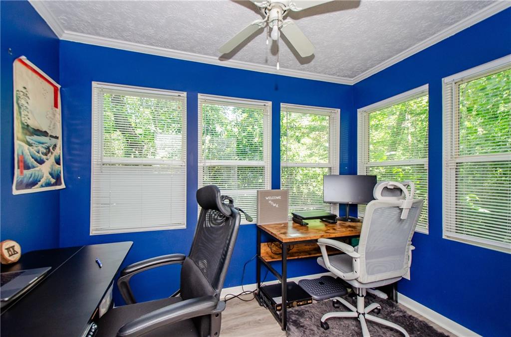 5157 Roswell Road, Unit 2 Atlanta, GA 30342 - Photo 10 of 24 a view of a workspace with furniture and a window