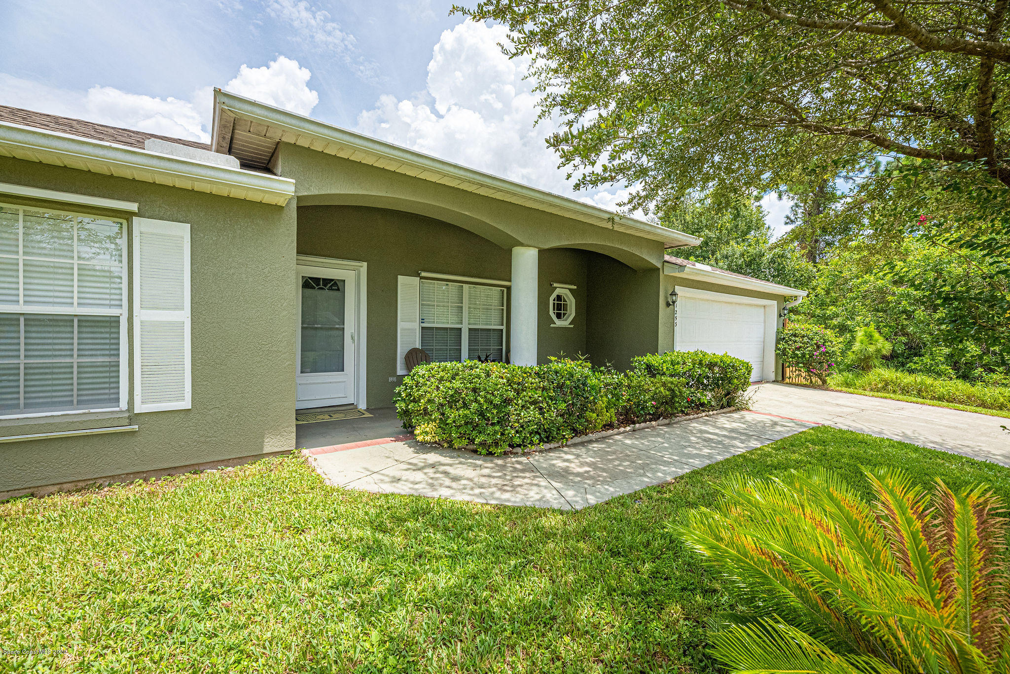 1253 Haulover Road Southwest Palm Bay, FL 32908 - Photo 2 of 52 a view of an house with backyard space and garden