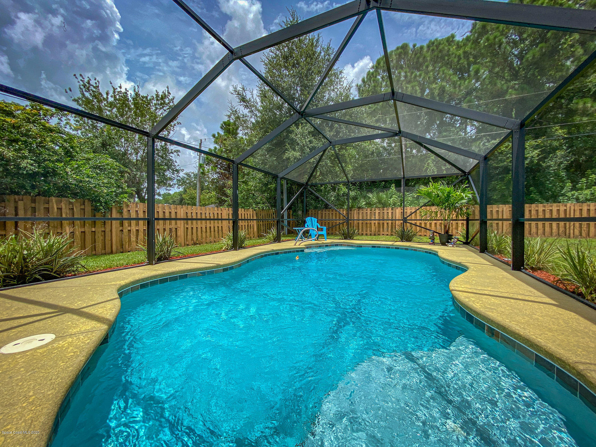 1253 Haulover Road Southwest Palm Bay, FL 32908 - Photo 12 of 52 a view of a backyard with a swimming pool