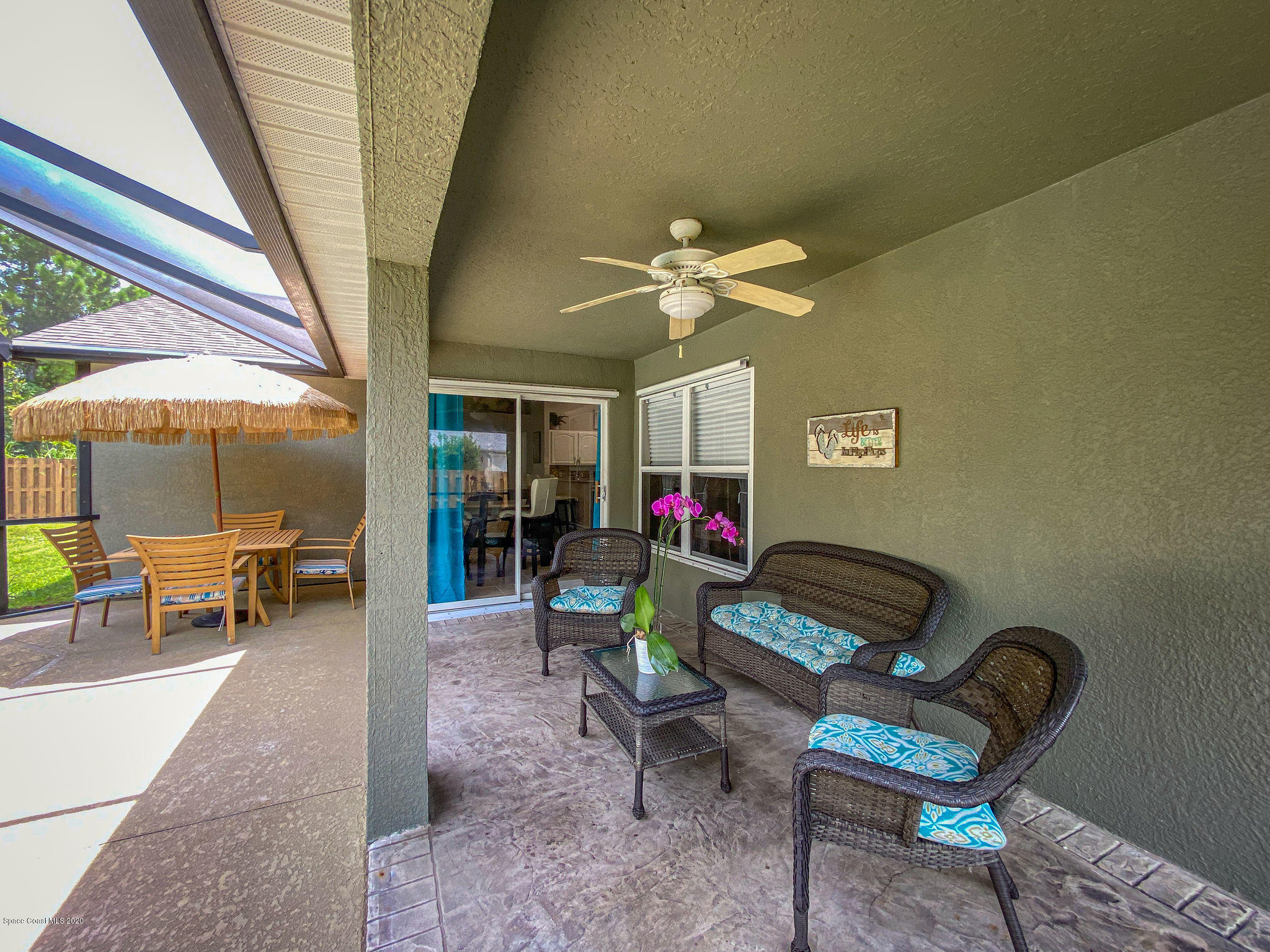 1253 Haulover Road Southwest Palm Bay, FL 32908 - Photo 14 of 52 a living room with furniture a dining table and a piano