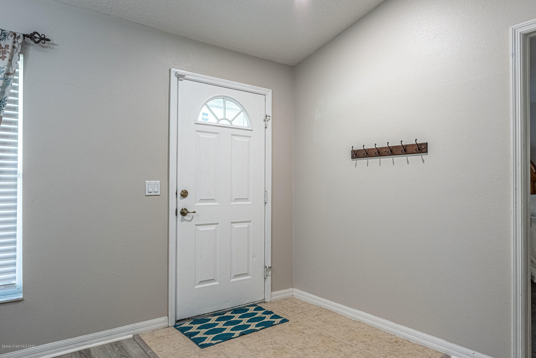 1253 Haulover Road Southwest Palm Bay, FL 32908 - Photo 16 of 52 a view of room with window and hallway