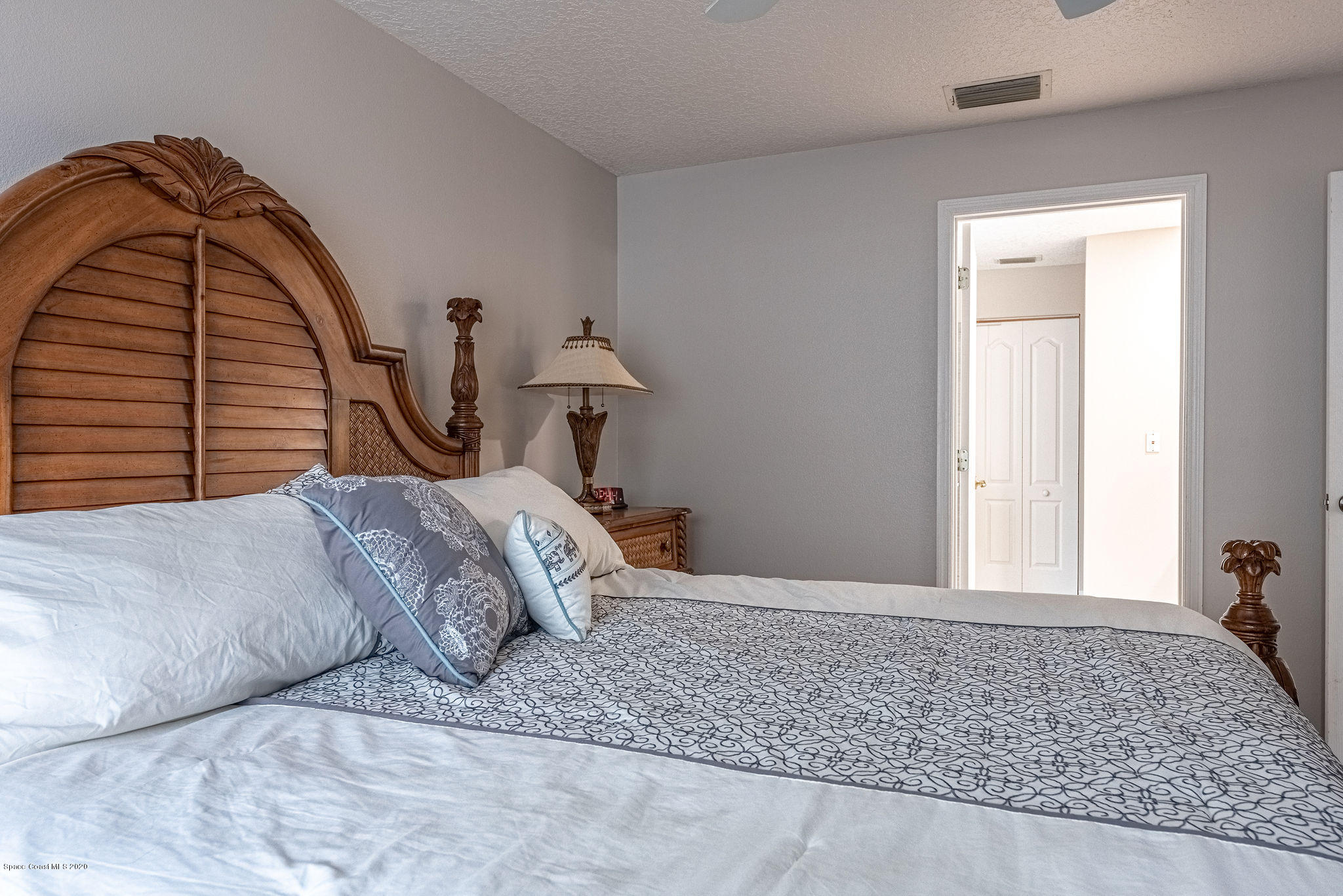 1253 Haulover Road Southwest Palm Bay, FL 32908 - Photo 21 of 52 a bedroom with a bed and a dresser