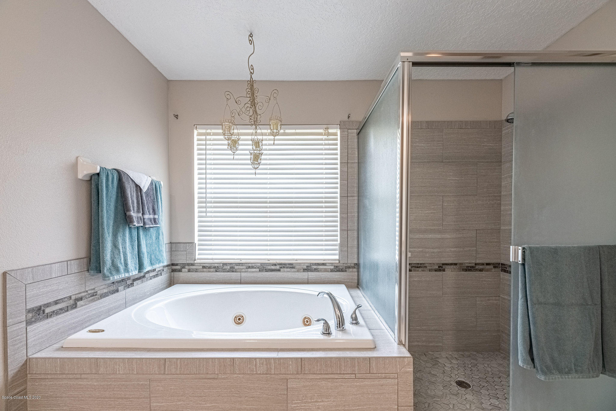 1253 Haulover Road Southwest Palm Bay, FL 32908 - Photo 23 of 52 a bathroom with a bathtub and shower