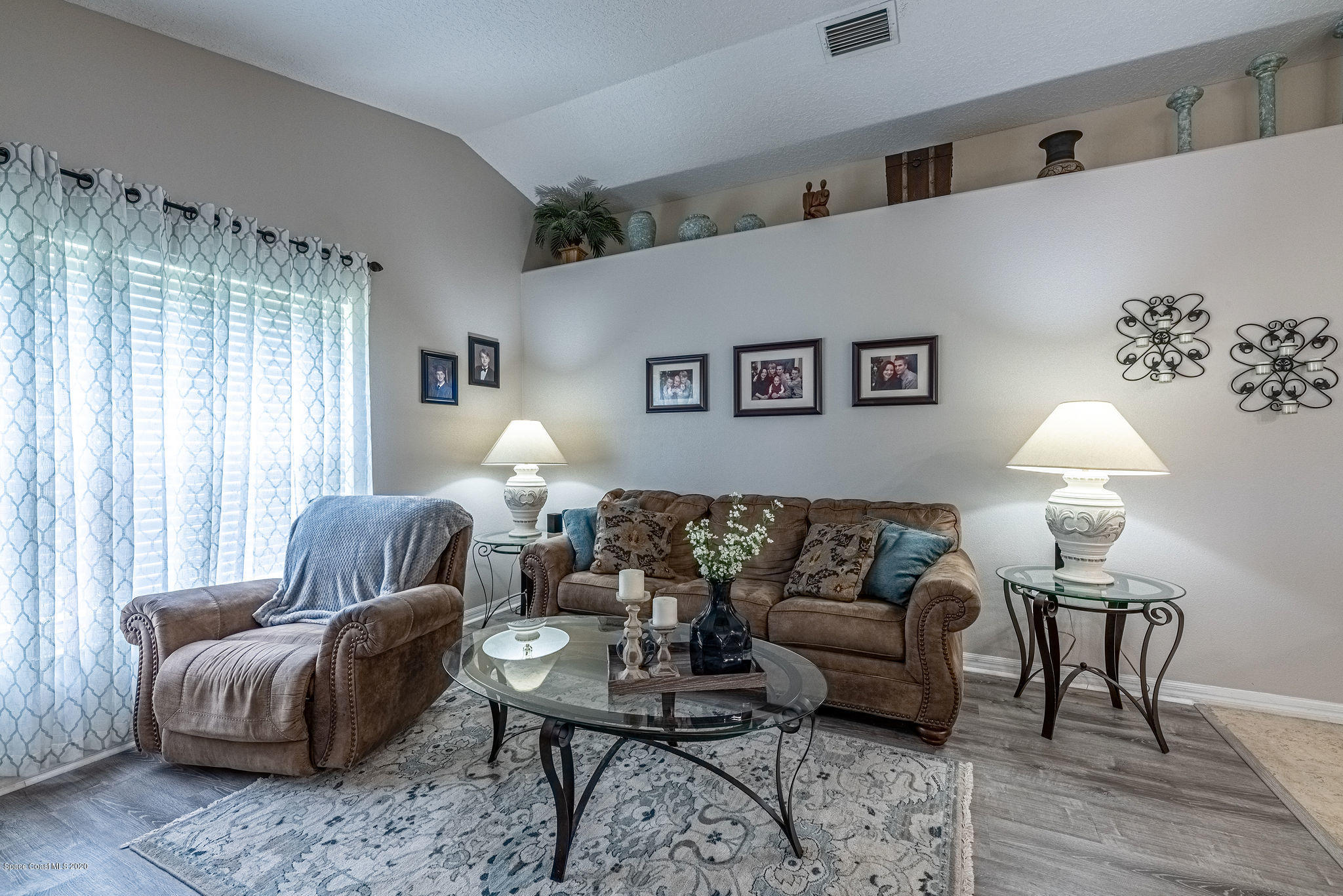 1253 Haulover Road Southwest Palm Bay, FL 32908 - Photo 31 of 52 a living room with furniture and a lamp