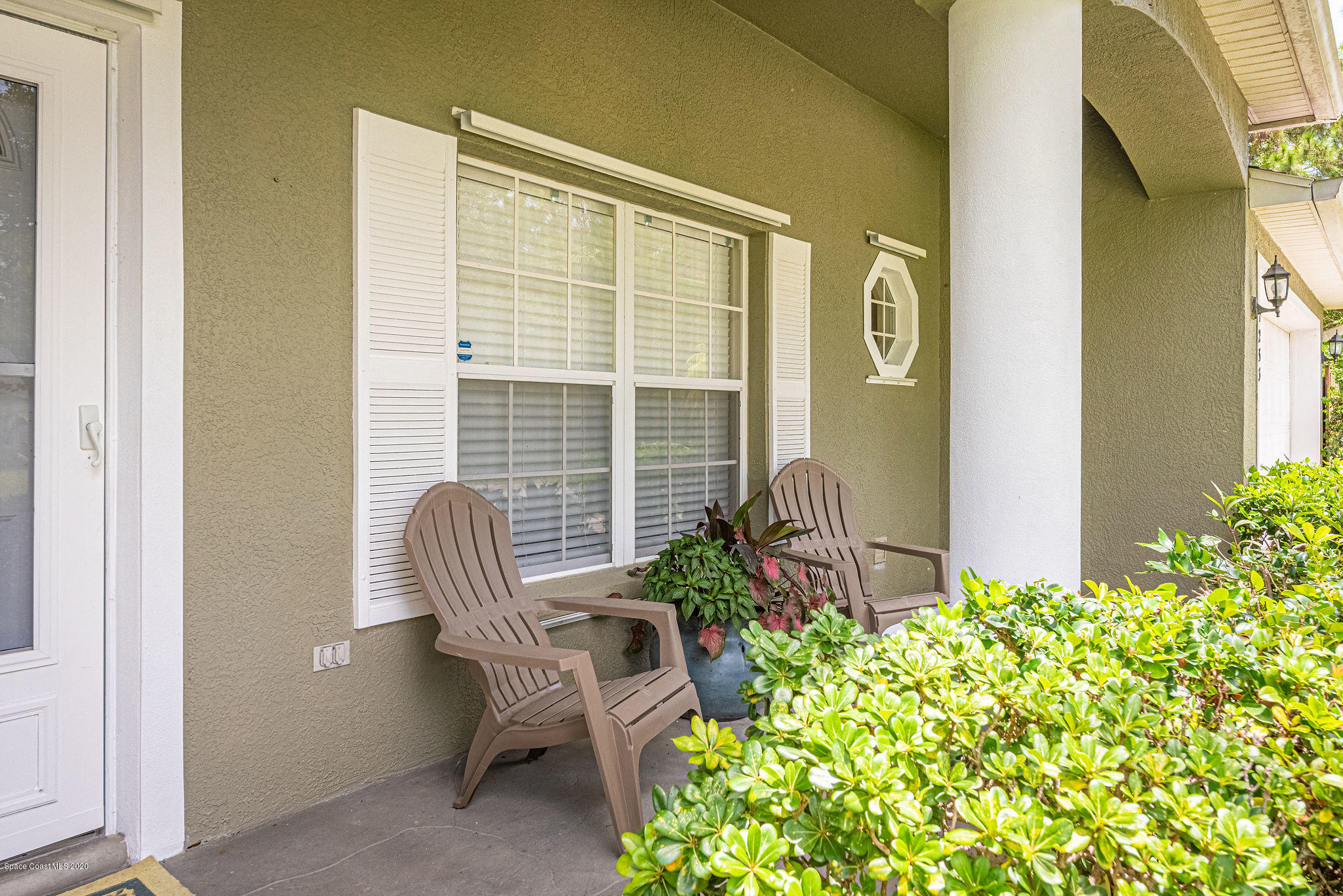 1253 Haulover Road Southwest Palm Bay, FL 32908 - Photo 6 of 52 a view of balcony with chair and flowers