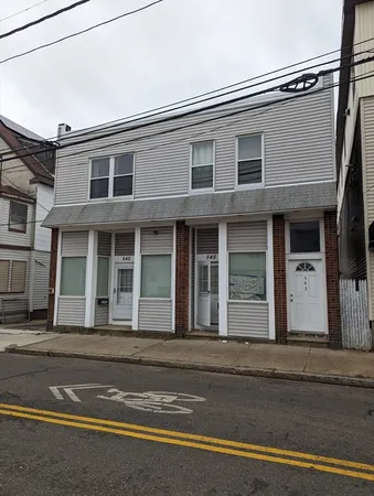 a view of a brick building with many windows