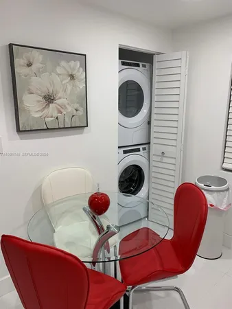a view of a living room with furniture and fan