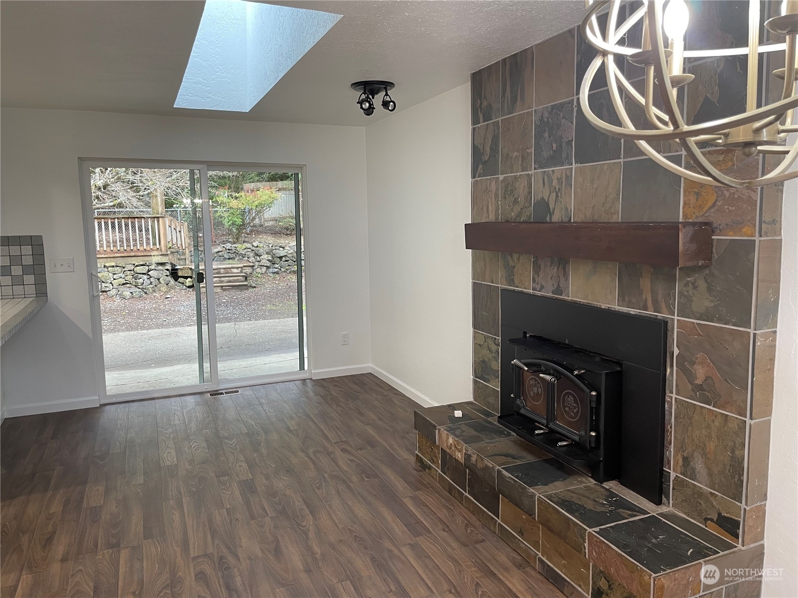 200 Southeast Harrier Road Shelton, WA 98584 - Photo 11 of 23 a view of a livingroom with wooden floor and a fireplace