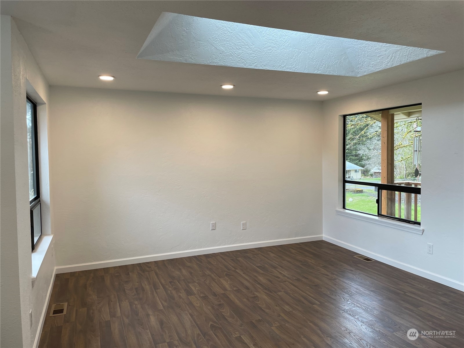 200 Southeast Harrier Road Shelton, WA 98584 - Photo 12 of 23 an empty room with wooden floor and windows