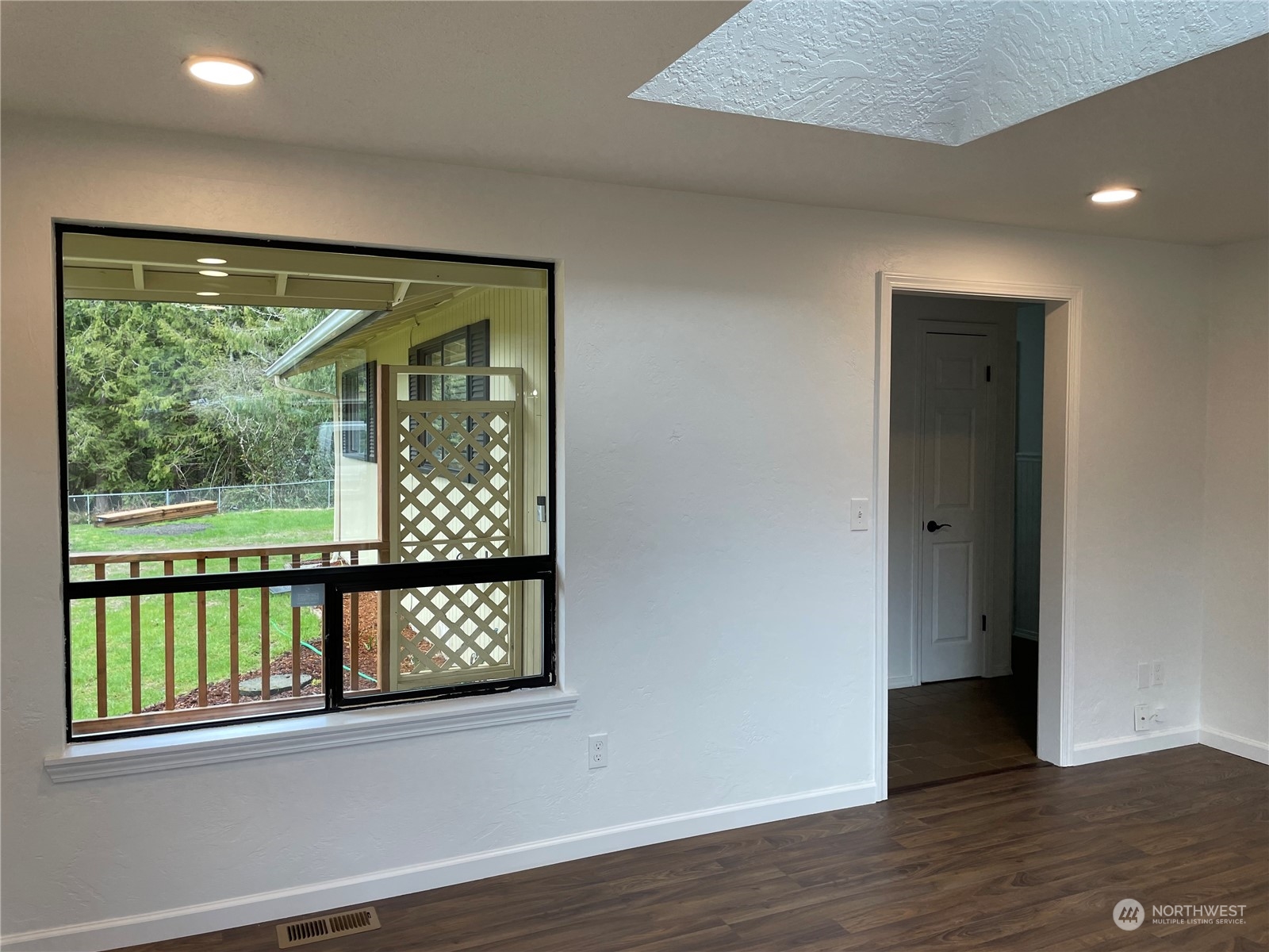 200 Southeast Harrier Road Shelton, WA 98584 - Photo 13 of 23 an empty room with wooden floor and windows