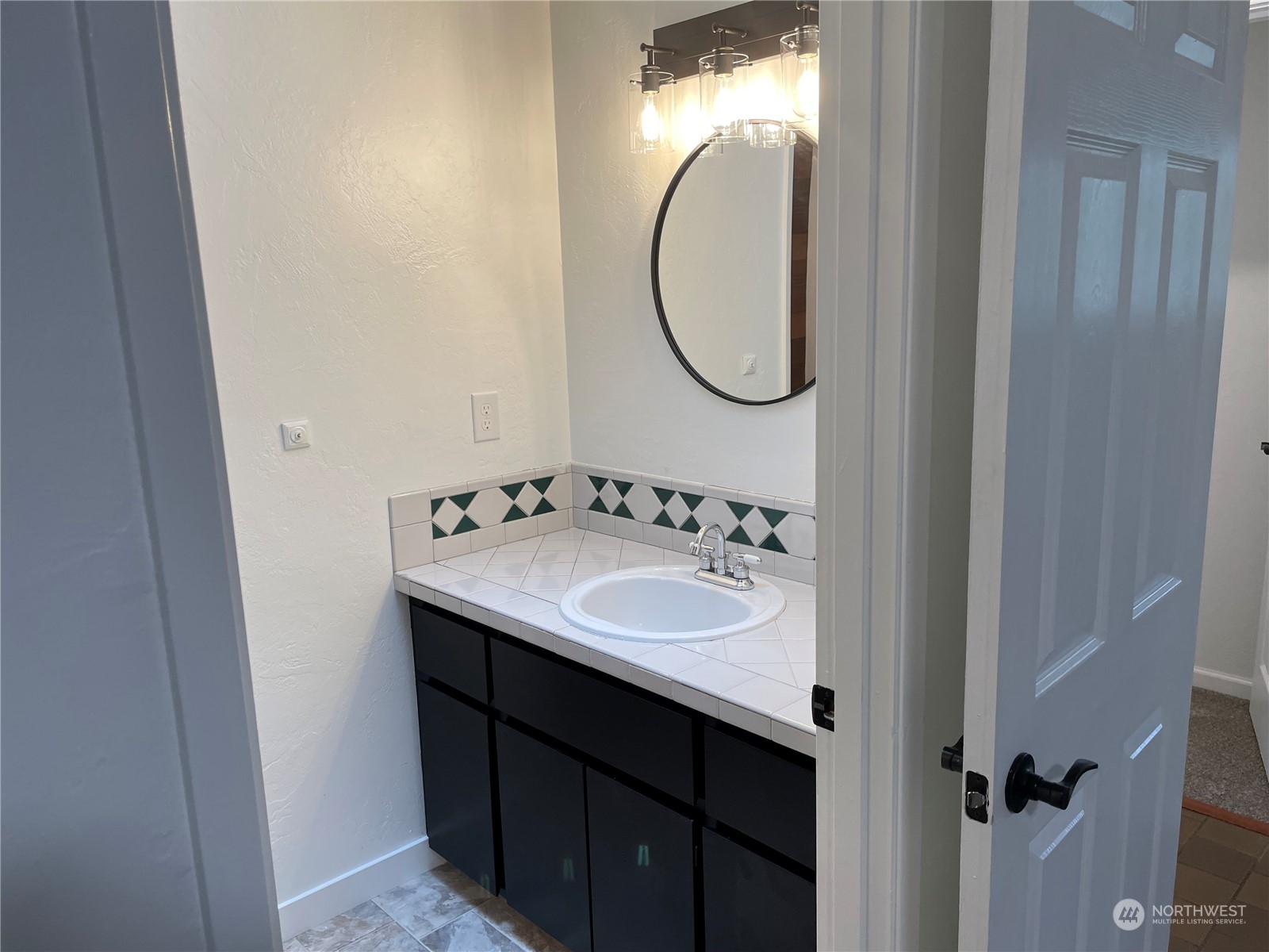 200 Southeast Harrier Road Shelton, WA 98584 - Photo 19 of 23 a bathroom with a sink and a mirror