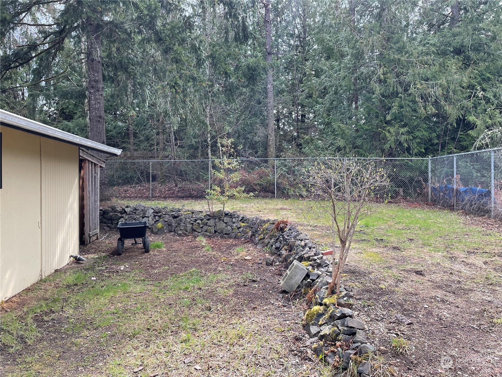 200 Southeast Harrier Road Shelton, WA 98584 - Photo 8 of 23 a view of a backyard with a trampoline