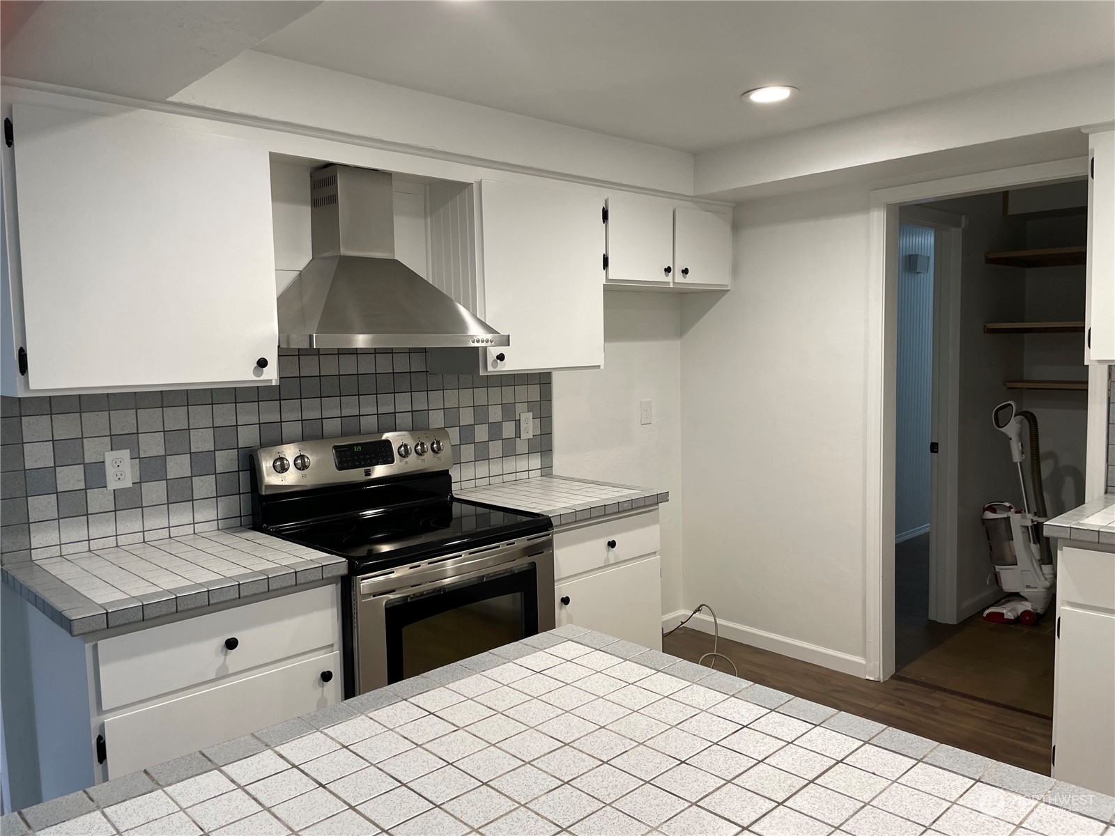 200 Southeast Harrier Road Shelton, WA 98584 - Photo 10 of 23 a kitchen with white cabinets and appliances