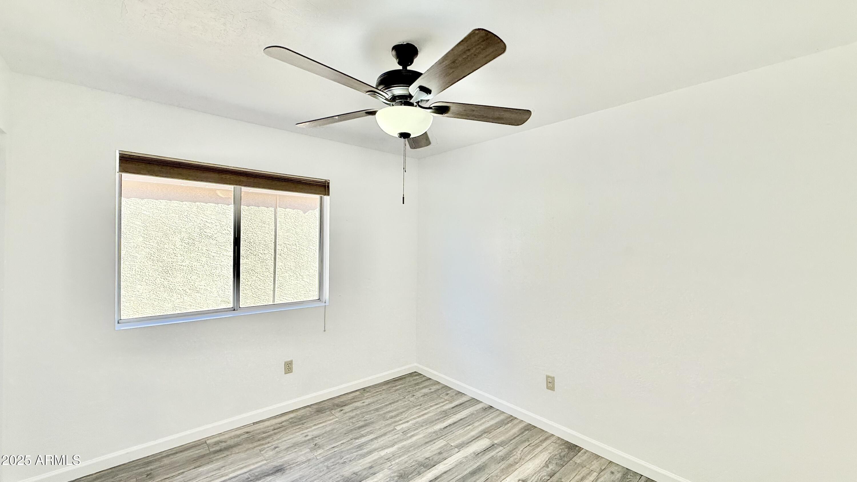 413 North Flint Street Gilbert, AZ 85234 - Photo 13 of 19 a view of room with window and ceiling fan
