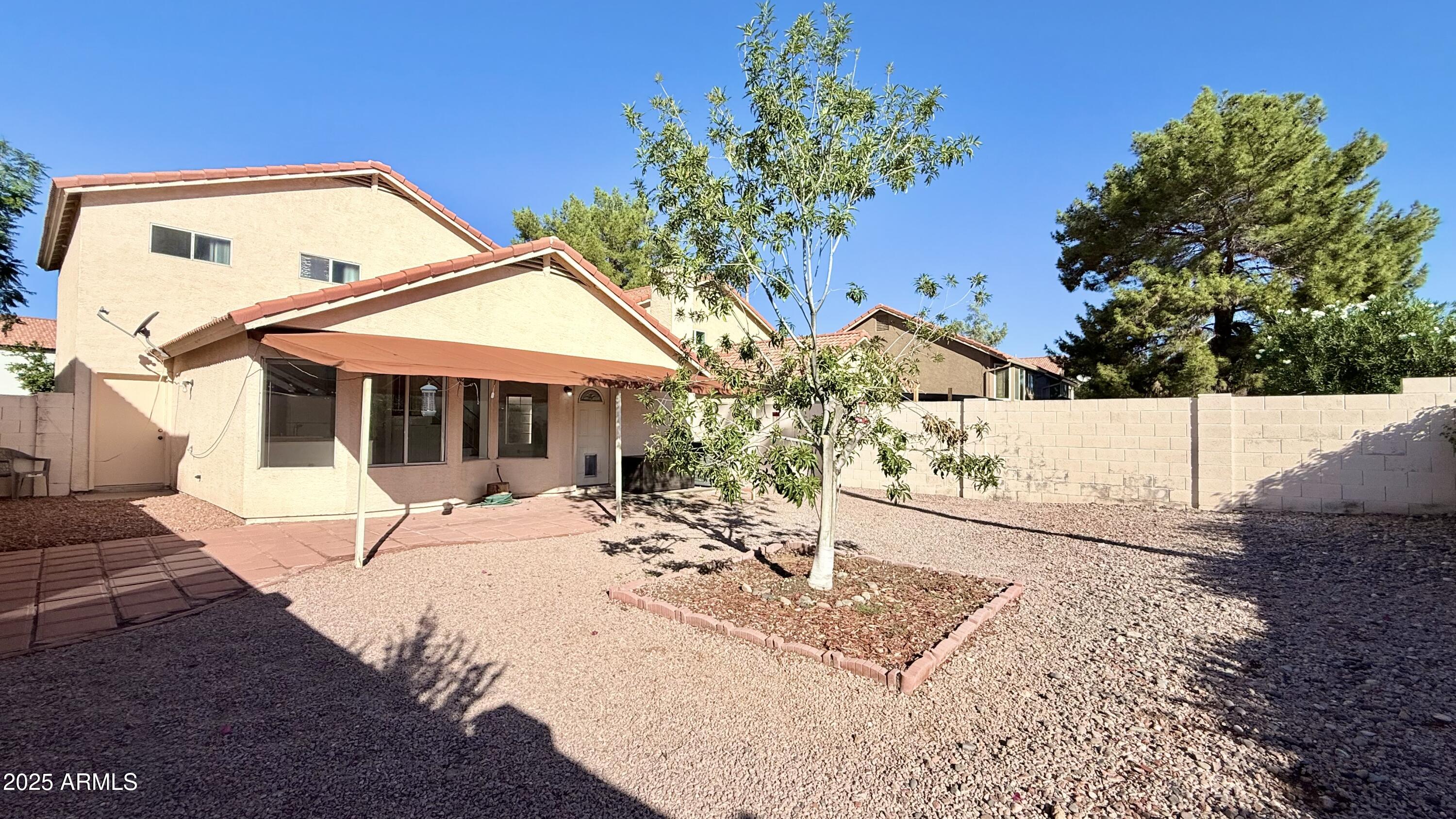 413 North Flint Street Gilbert, AZ 85234 - Photo 18 of 19 a view of a house with snow on the ground