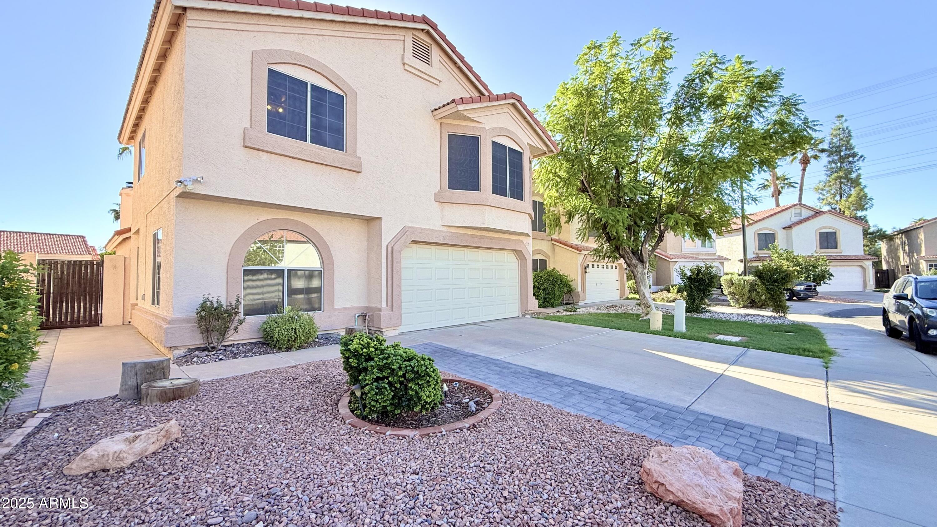 413 North Flint Street Gilbert, AZ 85234 - Photo 2 of 19 a view of a front of a house with a yard