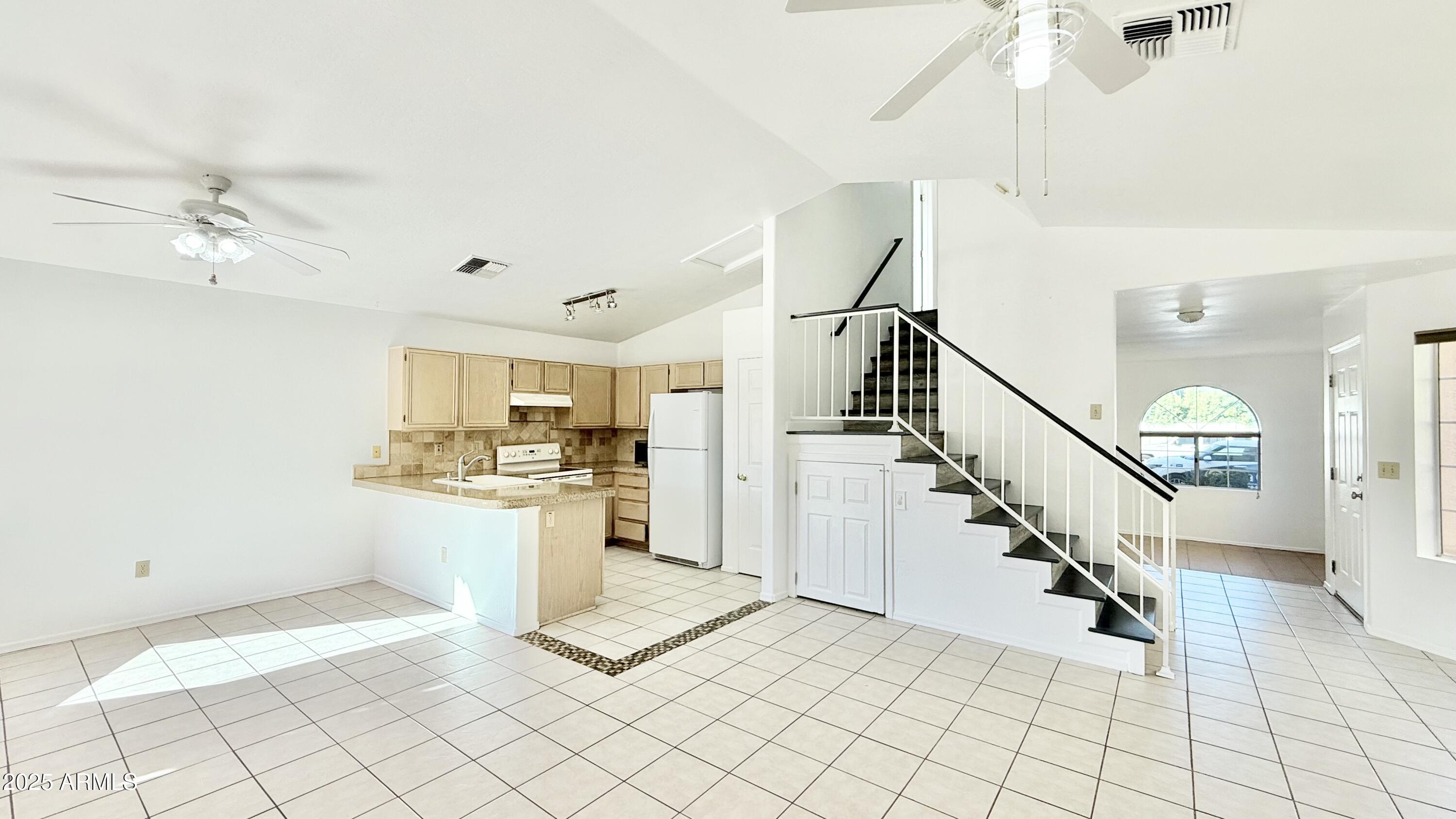 413 North Flint Street Gilbert, AZ 85234 - Photo 5 of 19 a view of a kitchen with a sink and cabinets