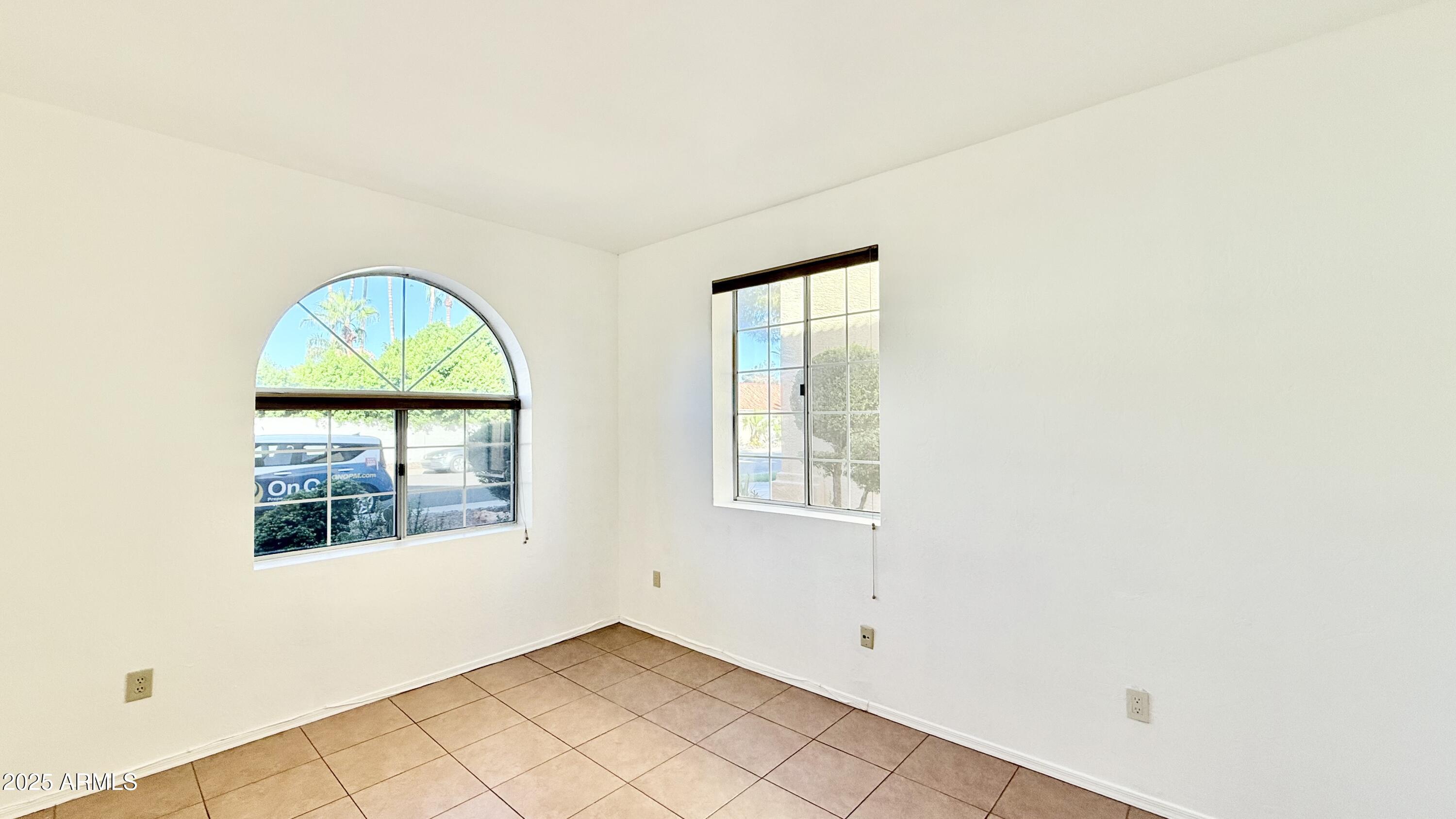 413 North Flint Street Gilbert, AZ 85234 - Photo 7 of 19 an empty room with windows