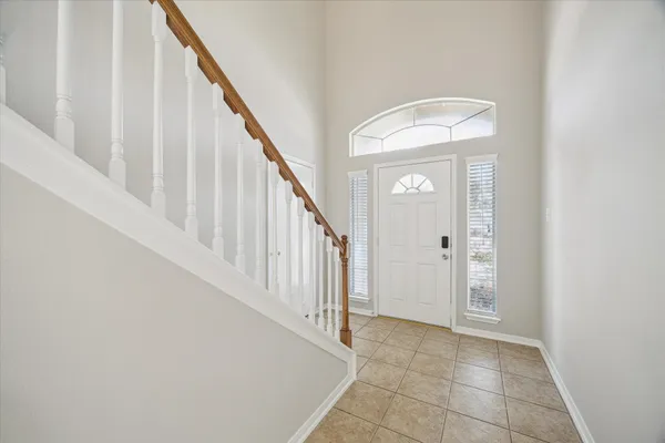 a view of an entryway with wooden floor