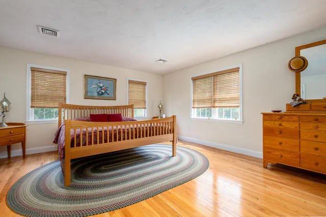a bedroom with furniture and window