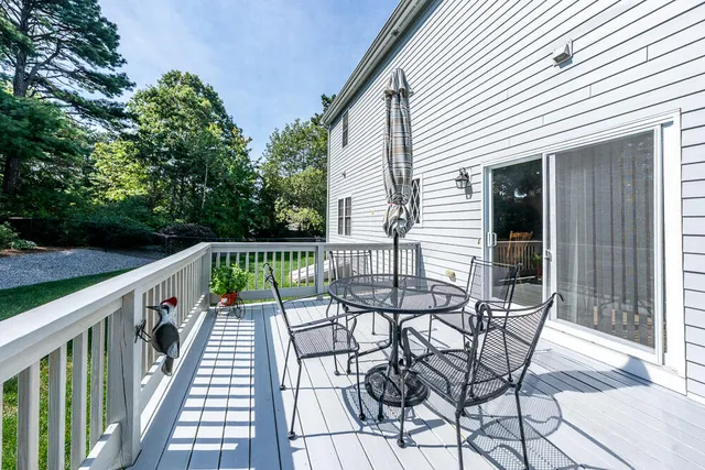 a view of balcony with furniture and wooden deck