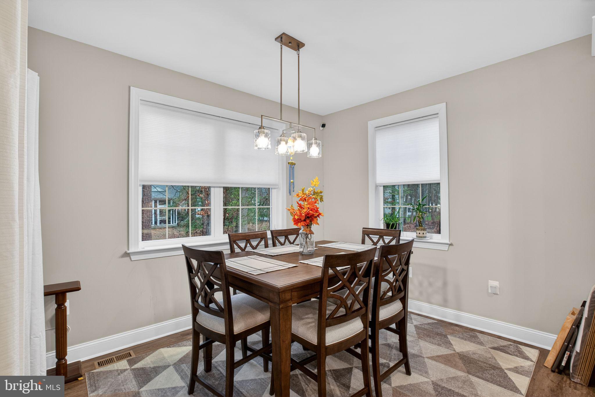 14730 Locust Court Swan Point, MD 20645 - Photo 15 of 30 a view of a dining room with furniture window and outside view