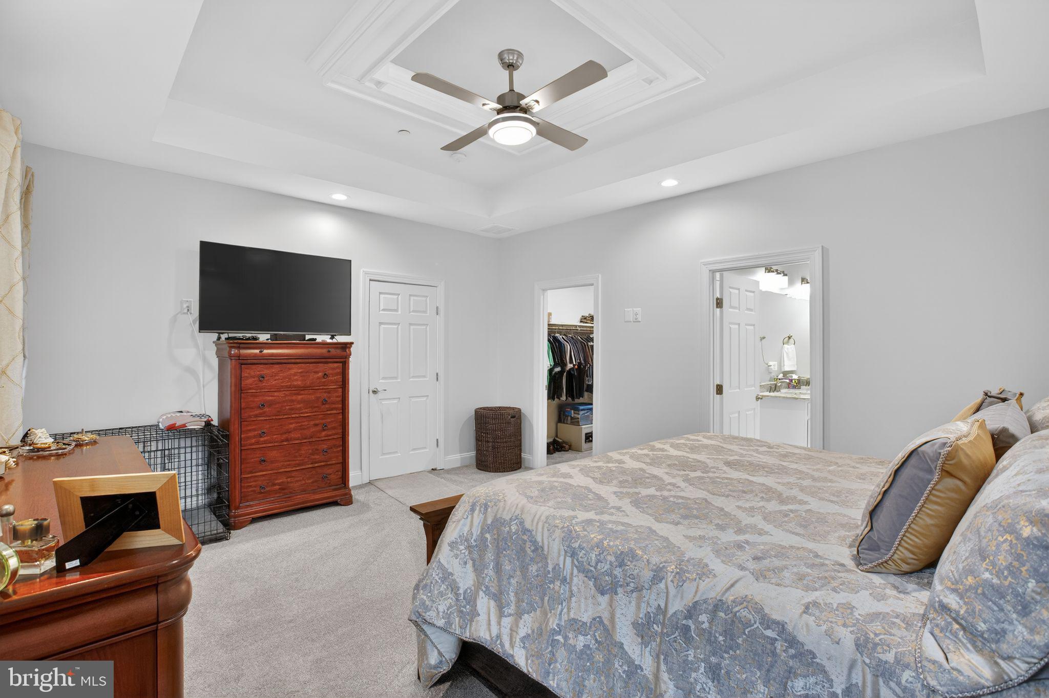 14730 Locust Court Swan Point, MD 20645 - Photo 21 of 30 a bedroom with a bed and a flat screen tv