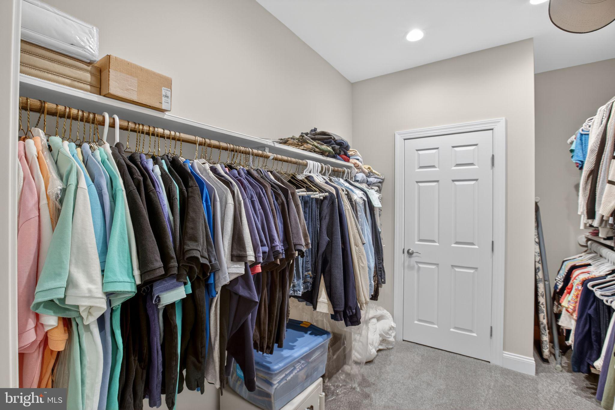 14730 Locust Court Swan Point, MD 20645 - Photo 22 of 38 a view of walk in closet with clothes and shoes