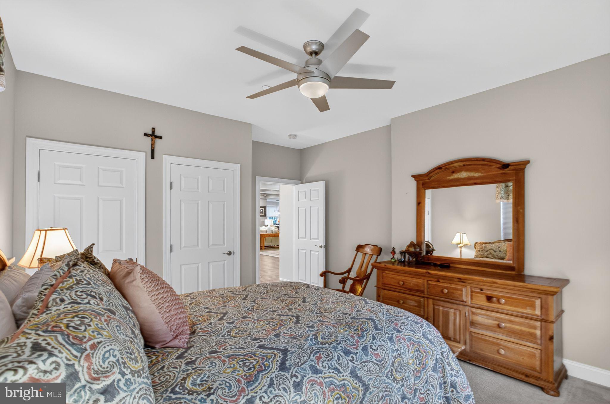14730 Locust Court Swan Point, MD 20645 - Photo 23 of 38 a bedroom with a bed and a dresser