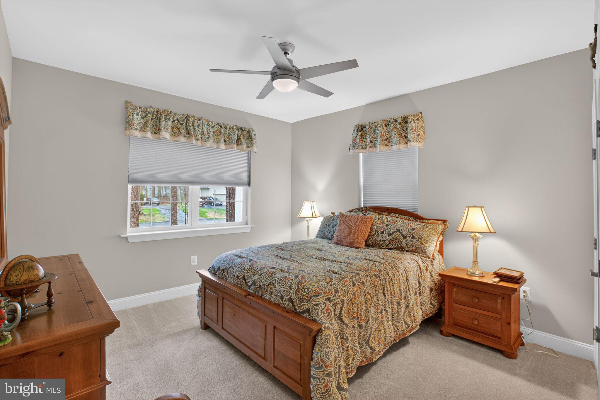 14730 Locust Court Swan Point, MD 20645 - Photo 26 of 38 a bedroom with a bed and window